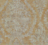 Ronald Redding Charleston Damask Wallpaper featuring a distressed, faded damask floral pattern in light tan over a golden-brown background.