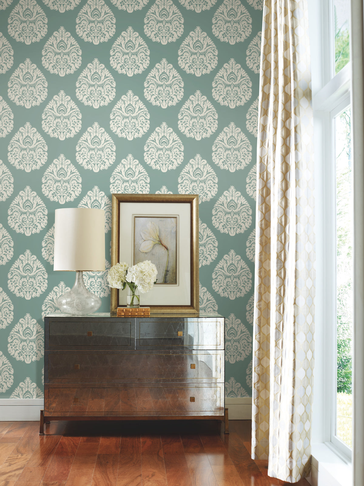 Ronald Redding Teardrop Damask Wallpaper in teal, featuring a repeating white teardrop-shaped damask pattern.