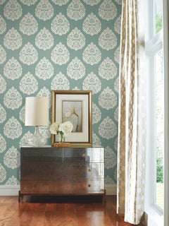 Ronald Redding Teardrop Damask Wallpaper in teal, featuring a repeating white teardrop-shaped damask pattern.