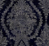 Ronald Redding Charleston Damask Wallpaper featuring a dark navy blue background with a faded, beige, ornate damask floral pattern.