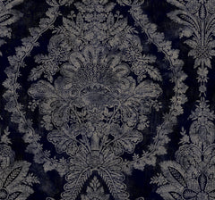 Ronald Redding Charleston Damask Wallpaper featuring a dark navy blue background with a faded, beige, ornate damask floral pattern.