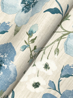 Close-up of the Evelyn Floral Wallpaper by York Wallcoverings, showcasing a floral pattern with large blue flowers, smaller white blossoms, and green stems set against a light, textured background.
