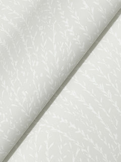 Willow Song Botanical Wallpaper by York Wallcoverings features a subtle, delicate leafy branch pattern in a matte finish, arranged diagonally across a white background. The design offers a soft, elegant, and minimalistic look.