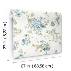 The Veiled Garden Floral Wallpaper by York Wallcoverings features a floral pattern in blue, green, and beige tones. Each roll measures 27 feet (8.22 meters) in length and 27 inches (68.58 cm) in width.
