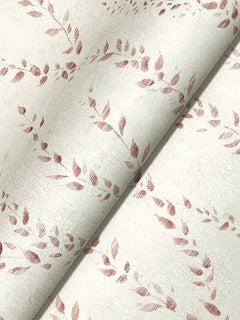 A close-up of York Wallcoverings’ Alpenrose Vine Wallpaper, featuring a subtle crackle texture and a repeating pattern of reddish-brown leafy branches on a light beige background. The paper is slightly curled, offering an angled view of the elegant design.