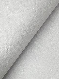 Close-up of York Wallcoverings’ Hempfield Weave Loomed Wallpaper in light gray, featuring a finely textured surface with subtle diagonal lines that create a soft, smooth appearance. The image highlights the wallpaper’s distinctive weave and slight sheen under the light.