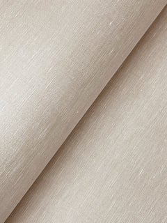 A close-up of the Hempfield Weave Loomed Wallpaper by York Wallcoverings showcases its beige, textured surface with visible threads and a subtle sheen, arranged diagonally across the frame.