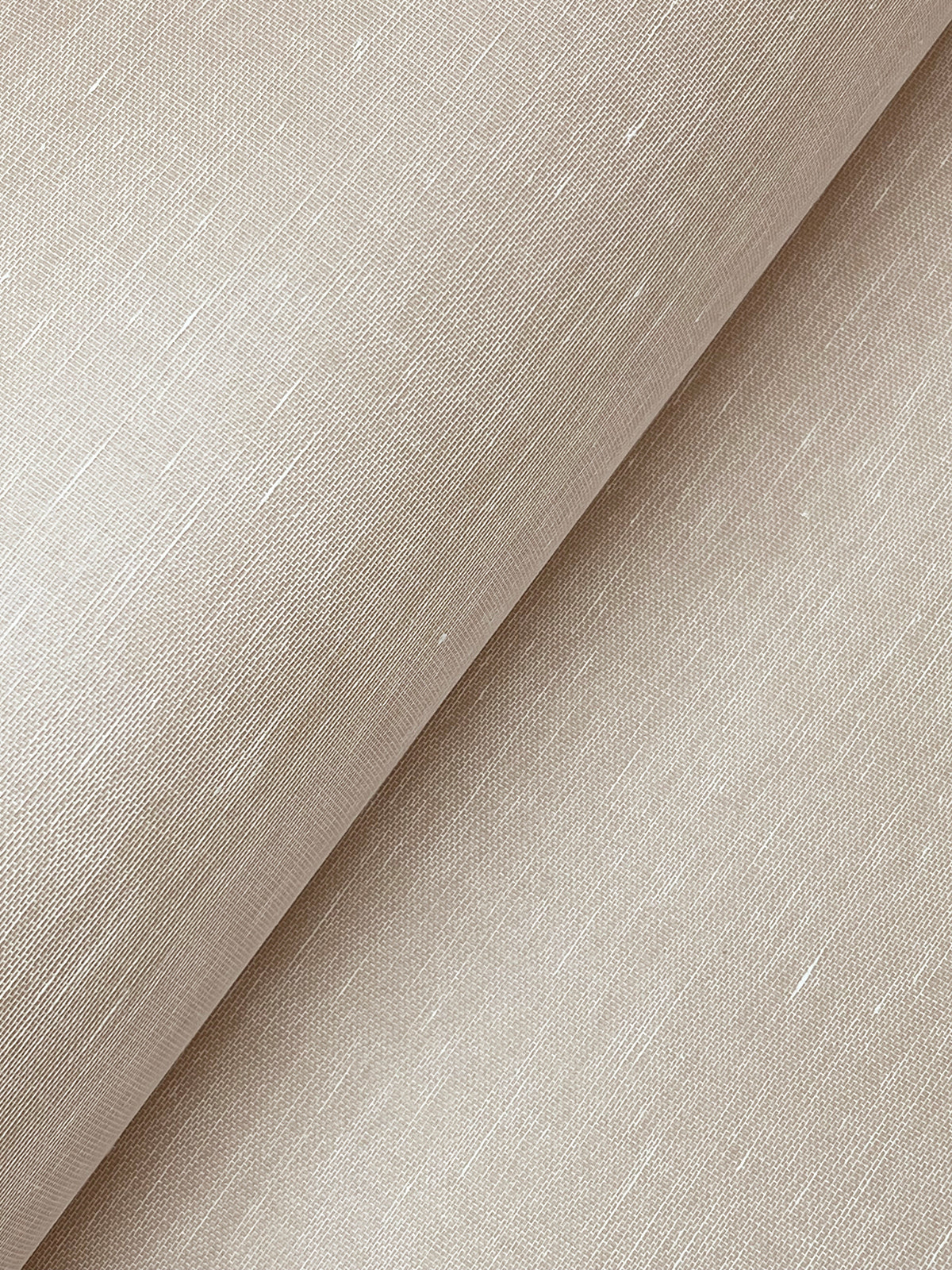 A close-up of York Wallcoverings’ Hempfield Weave Loomed Wallpaper, showcasing its beige, textured surface with a subtle horizontal weave pattern. The wallpaper appears soft and slightly lustrous, with visible threads enhancing its organic look.
