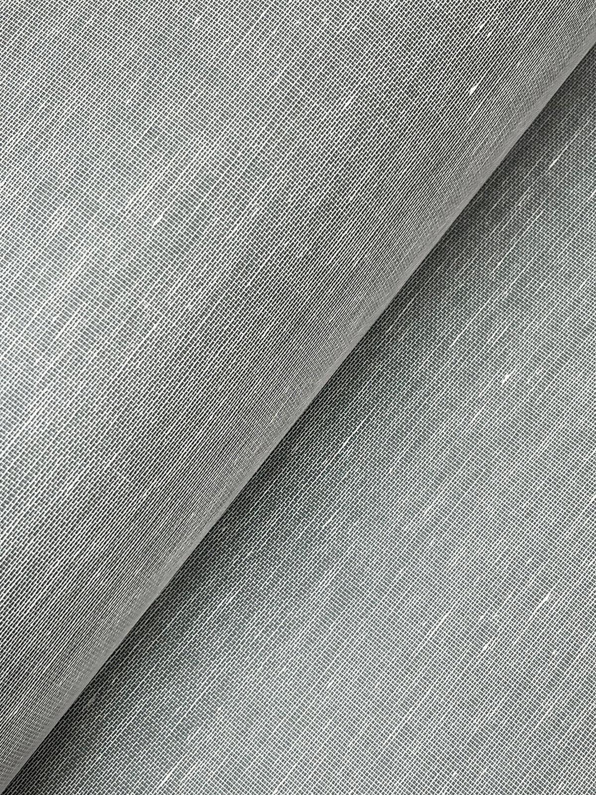 Close-up of a roll of York Wallcoverings’ Hempfield Weave Loomed Wallpaper in light gray, highlighting the fine threads and subtle diagonal woven texture.
