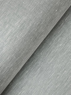 Close-up of a roll of York Wallcoverings’ Hempfield Weave Loomed Wallpaper in light gray, highlighting the fine threads and subtle diagonal woven texture.