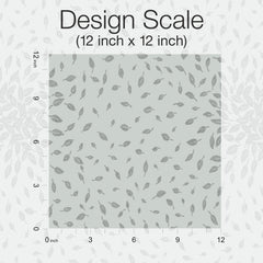 Featuring a square pattern of scattered gray leaves on a light background, the Petite Leaves Wallpaper by York Wallcoverings is shown at a Design Scale of 12 inches by 12 inches, with rulers marking inches along the edges.