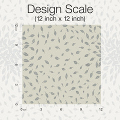 Petite Leaves Wallpaper by York Wallcoverings is shown in a 12 inch by 12 inch square pattern, featuring small gray leaves scattered on a light beige background. The image includes labels for the dimensions, with “Design Scale (12 inch x 12 inch)” displayed at the top.