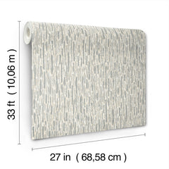 The York Wallcoverings Metallic Cascade Wallpaper is a roll of textured wallpaper featuring a gray and white abstract pattern, measuring 33 feet (10.06 m) long and 27 inches (68.58 cm) wide.