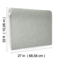 The image features a roll of York Wallcoverings’ Metallic Cascade Wallpaper, displayed upright with a subtle gray pattern. Text on the image notes its dimensions: 33 feet (10.06 m) in length and 27 inches (68.58 cm) in width.
