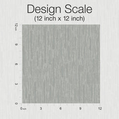 A 12 inch by 12 inch gray square sample of York Wallcoverings Metallic Cascade Wallpaper, featuring subtle textured detailing and bordered by vertical and horizontal rulers, with “Design Scale (12 inch x 12 inch)” labeled at the top.