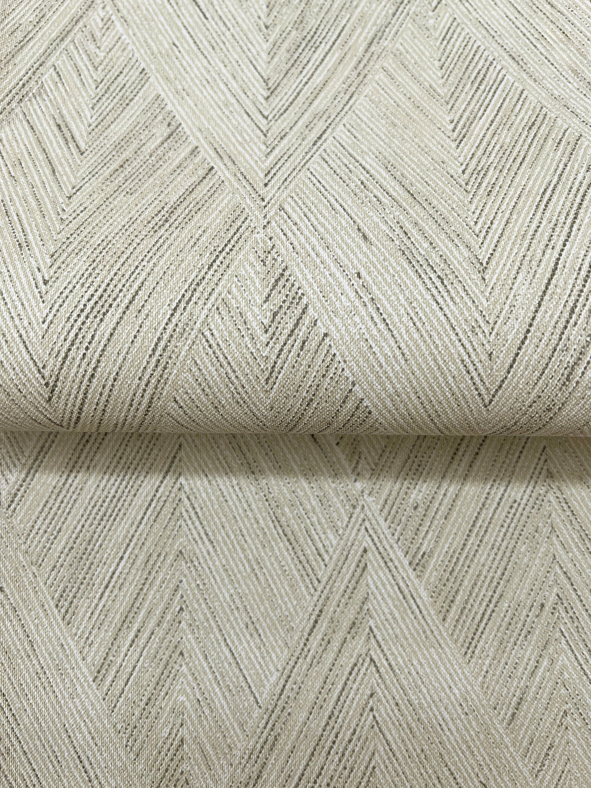 Magnolia Home Challenger Wallpaper featuring a light beige geometric chevron pattern created by thin, dark vertical lines.