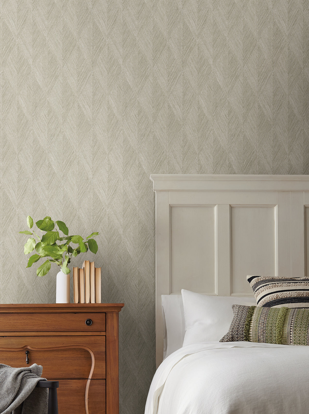 Bedroom wall featuring Magnolia Home Challenger Wallpaper by York Wallcoverings with a textured, neutral-toned herringbone pattern.