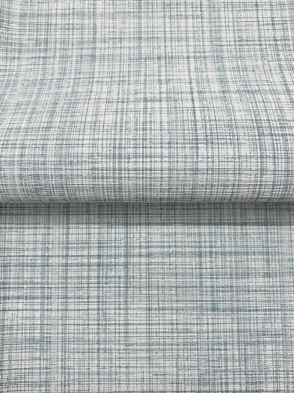 Magnolia Home Crossroad Wallpaper featuring a blue and white crosshatch grid pattern.