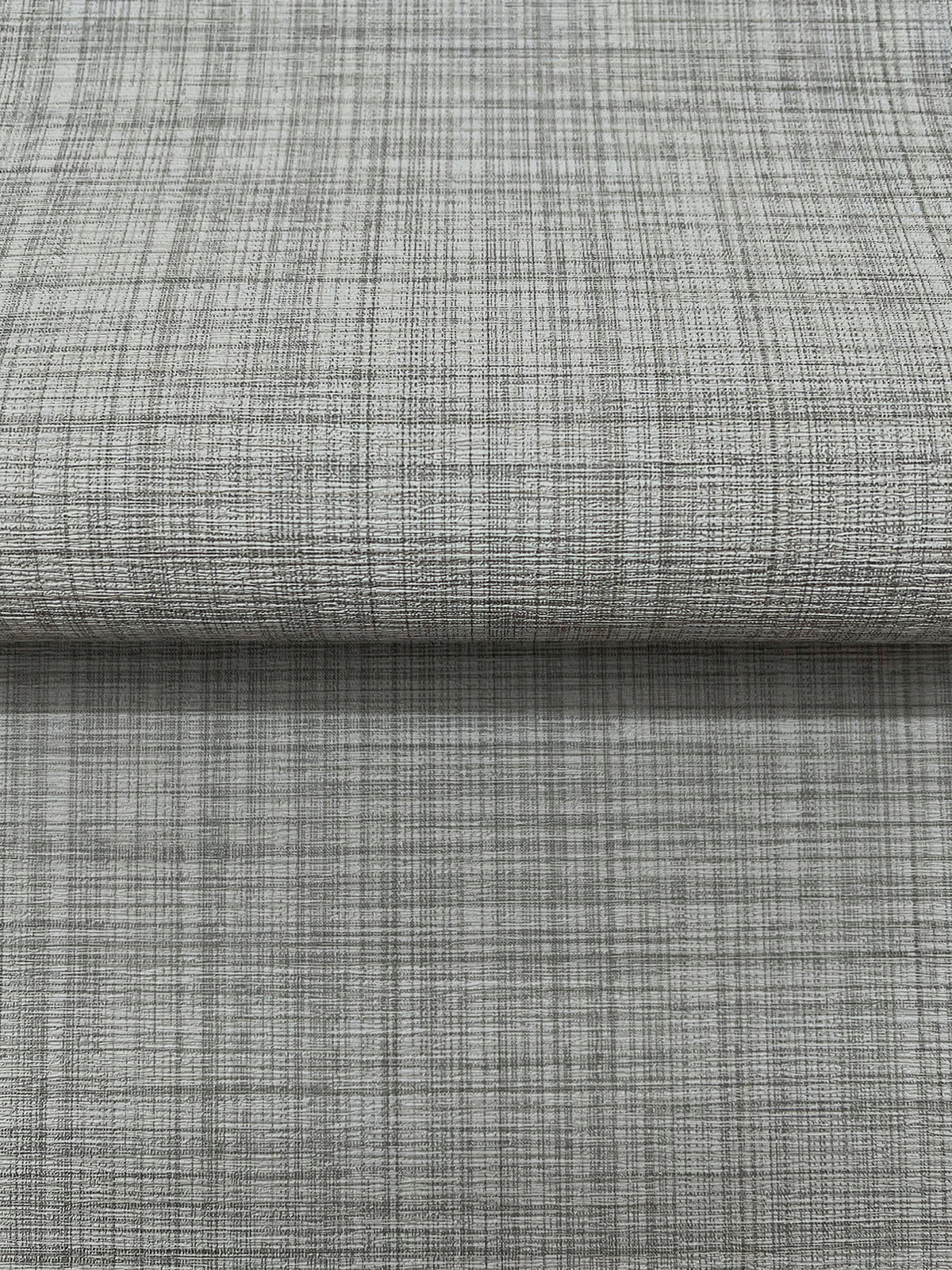 Magnolia Home Crossroad Wallpaper in gray with a textured, subtle grid pattern of fine intersecting lines.