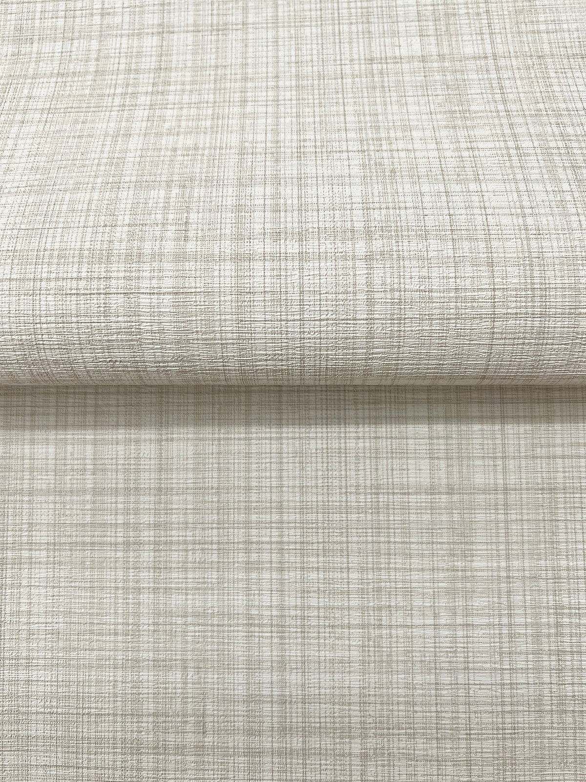 Magnolia Home Crossroad Wallpaper with a neutral-toned, fine-lined grid pattern that resembles textured fabric.