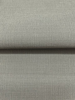 A folded piece of gray Magnolia Home Meadowbrook Wallpaper featuring a textured, woven fabric pattern.