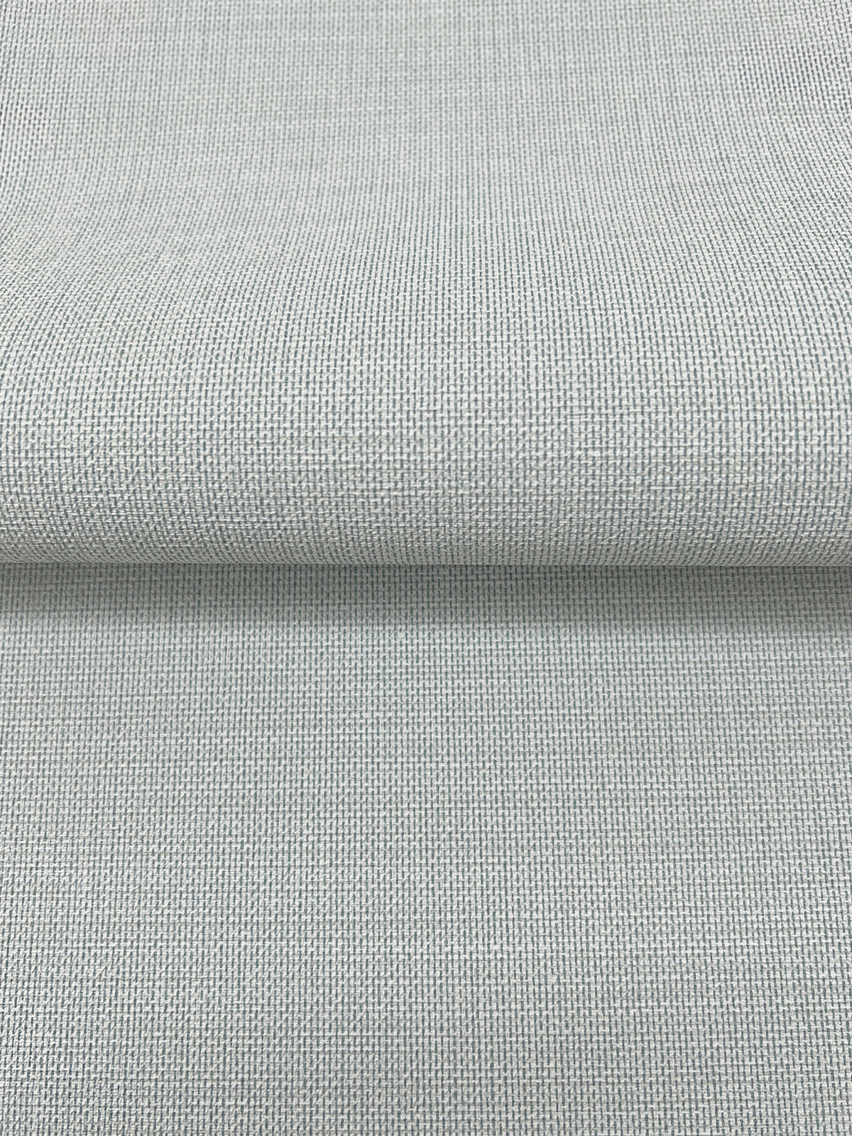 Magnolia Home Meadowbrook Wallpaper in light gray with a textured, woven fabric appearance.