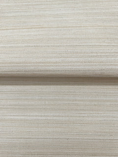 Close-up of a folded piece of beige Magnolia Home Loomed Wallpaper by York Wallcoverings, featuring a textured, woven-look horizontal pattern.