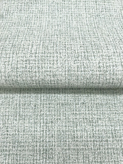 Magnolia Home Brindled Wallpaper in light gray featuring a subtle, dark gray grid pattern and a textured appearance.