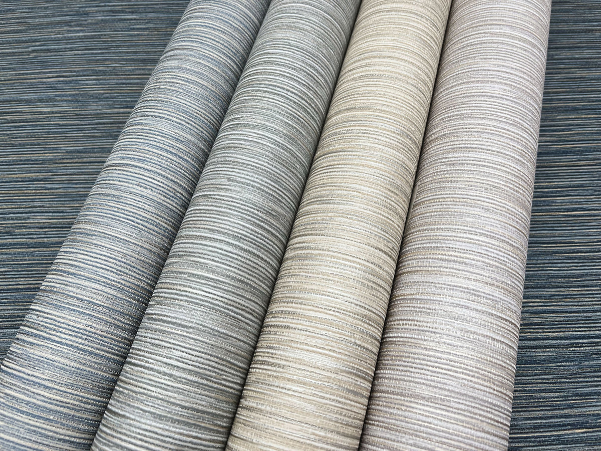 Four rolls of Grass Roots Wallpaper featuring a horizontal linear texture, displayed in shades of charcoal, grey, beige, and taupe.