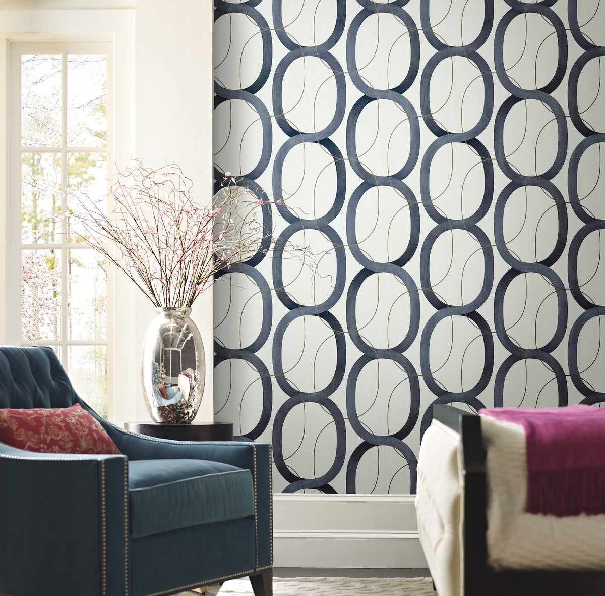 Candice Olson Interlock Wallpaper featuring a repeating pattern of dark blue interlocking oval rings on a light, textured background.