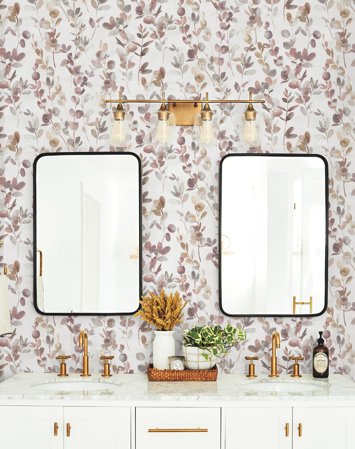 Double bathroom vanity with two rectangular mirrors and a light fixture mounted over York Wallcoverings Candice Olson Joyful Eucalpytus Wallpaper.