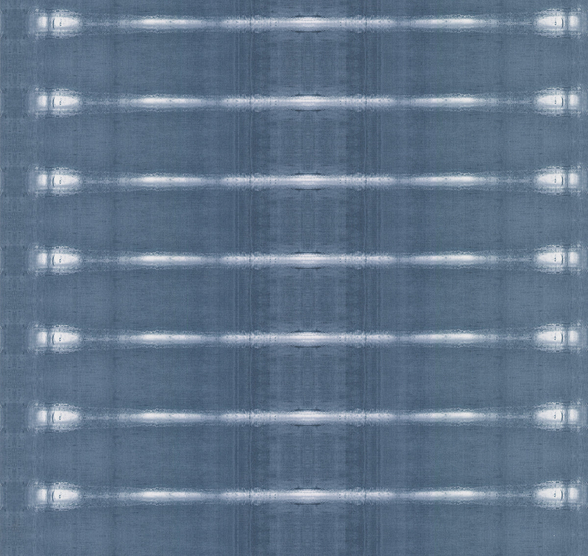 Resound Wallpaper by York Wallcoverings features a symmetrical, grid-like design of evenly spaced horizontal white lines across a blue-gray textured background, offering a slightly reflective appearance.