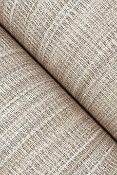 Close-up of York Wallcoverings’ Allineate Wallpaper in beige, highlighting its woven, grid-like texture and diagonal fold, which showcases the fine threads and soft, neutral color.