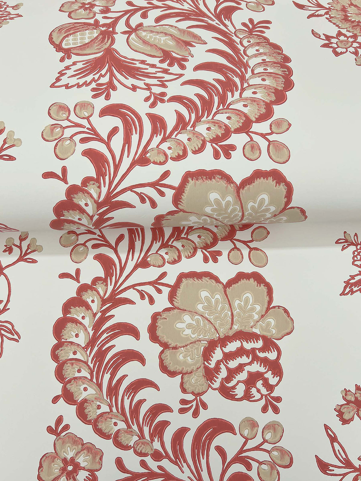 The Beaumont Floral Stripe Wallpaper by York Wallcoverings features red and beige floral and leaf motifs arranged in repeating stripes on a white background, with elegant swirling designs reminiscent of traditional vintage wallpaper.