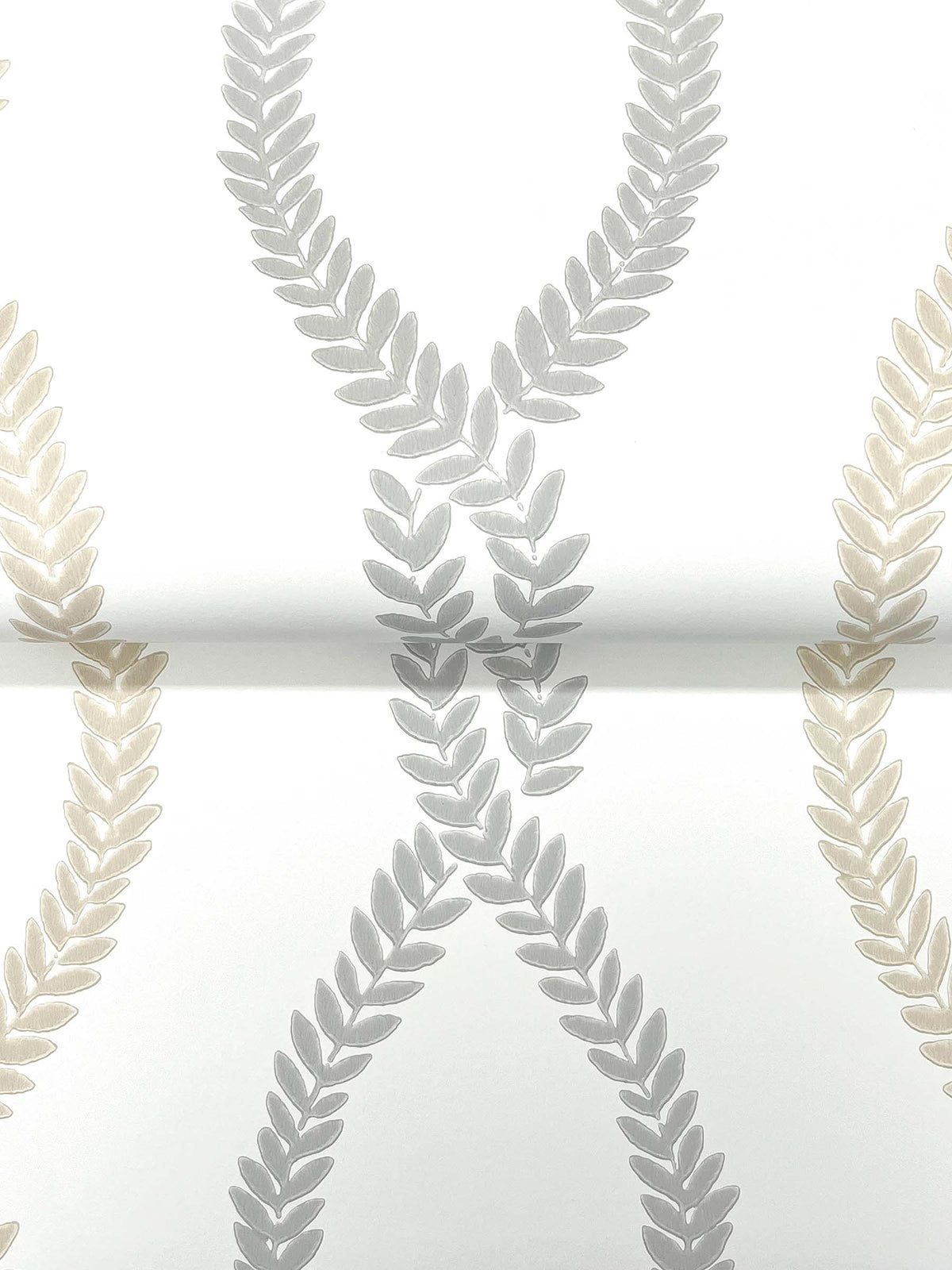 The Laureate Vine Trellis Wallpaper by York Wallcoverings features a repeating pattern of interlocking laurel wreaths in light gray and beige against a white background.