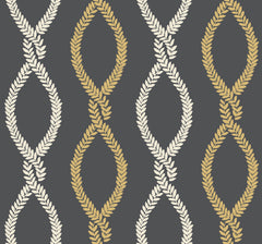York Wallcoverings’ Laureate Vine Trellis Wallpaper features a seamless pattern of cream and gold laurel leaf chains arranged in twisting, vertical, DNA-like forms on a dark gray background.