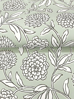Chatsworth Garden Floral Trail Wallpaper by York Wallcoverings features a detailed floral pattern, with large, black-outlined blossoms and leafy stems repeating across a pale green background.