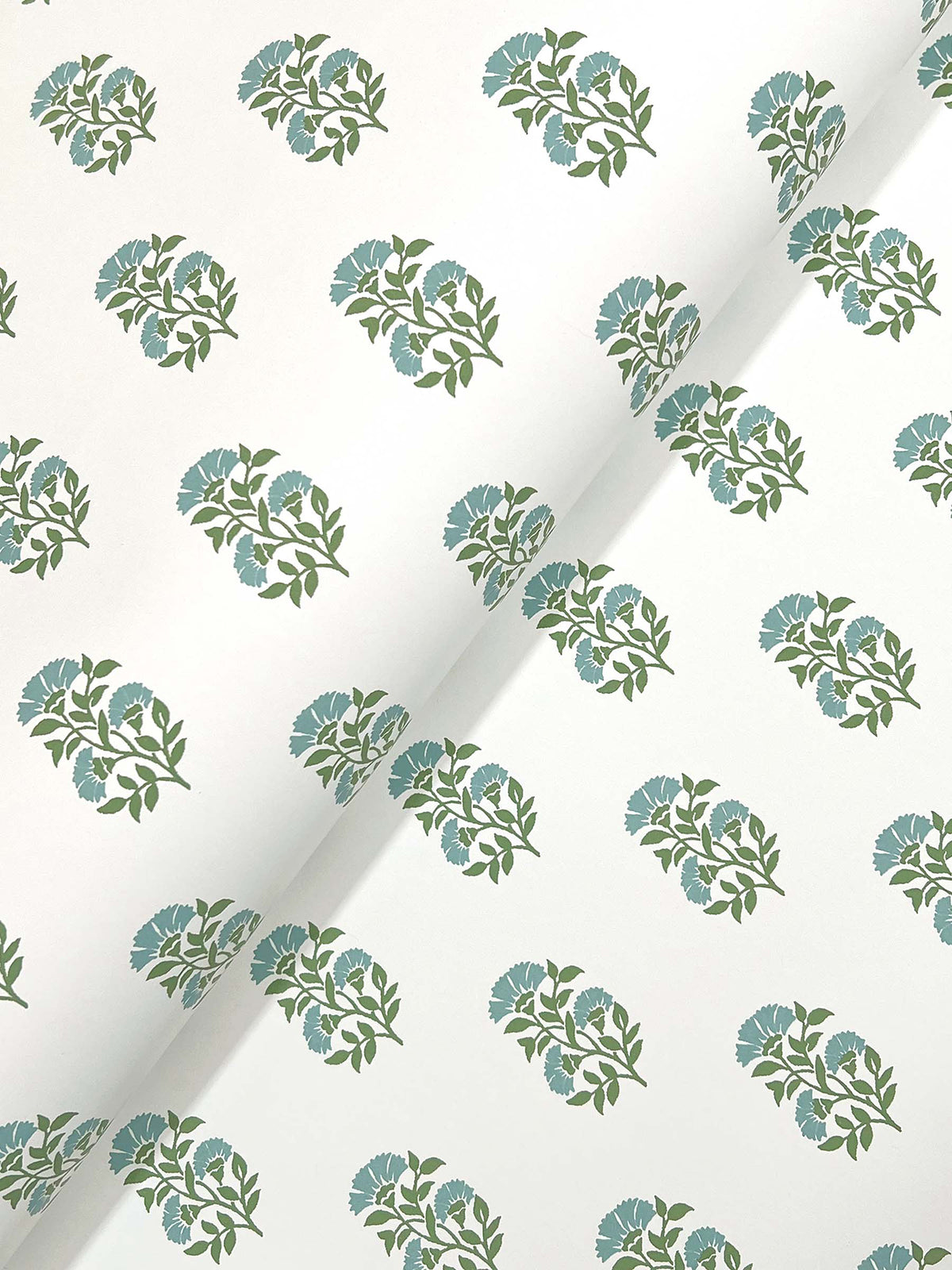 The Sylvie Floral Wallpaper by York Wallcoverings features a white background adorned with evenly spaced diagonal clusters of green stems and blue flowers.