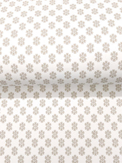 Brioni Floral Stamp Wallpaper by York Wallcoverings features a rolled white wallpaper adorned with a repeating pattern of small, light brown four-petal flowers evenly spaced across the surface.