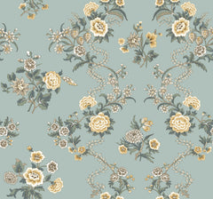 The Genevieve Floral Trail Wallpaper by York Wallcoverings features a seamless pattern of yellow, cream, and white flowers with green leaves and vines set against a muted blue-green background.