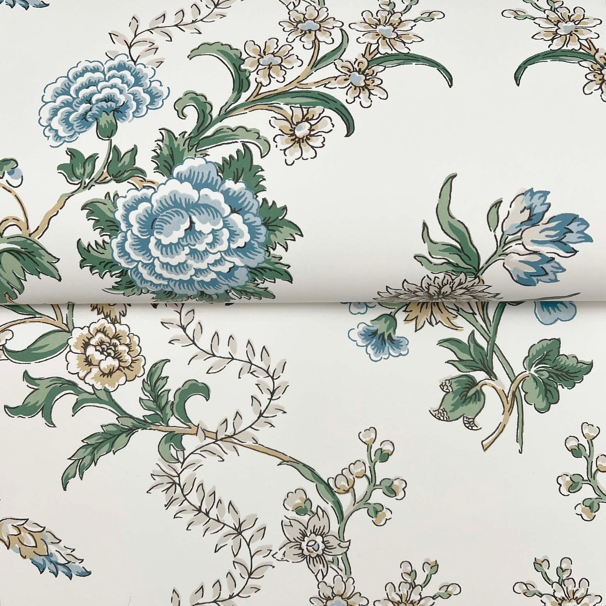 Introducing the Genevieve Floral Trail Wallpaper by York Wallcoverings—a white wallpaper roll featuring an intricate, vintage-inspired floral pattern adorned with blue, yellow, and white flowers and green leaves.