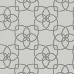 Featuring a modern and symmetrical design, the Serendipity Wallpaper by York Wallcoverings showcases a repeating geometric pattern of interlocking circles and curved lines in light gray on a white background.